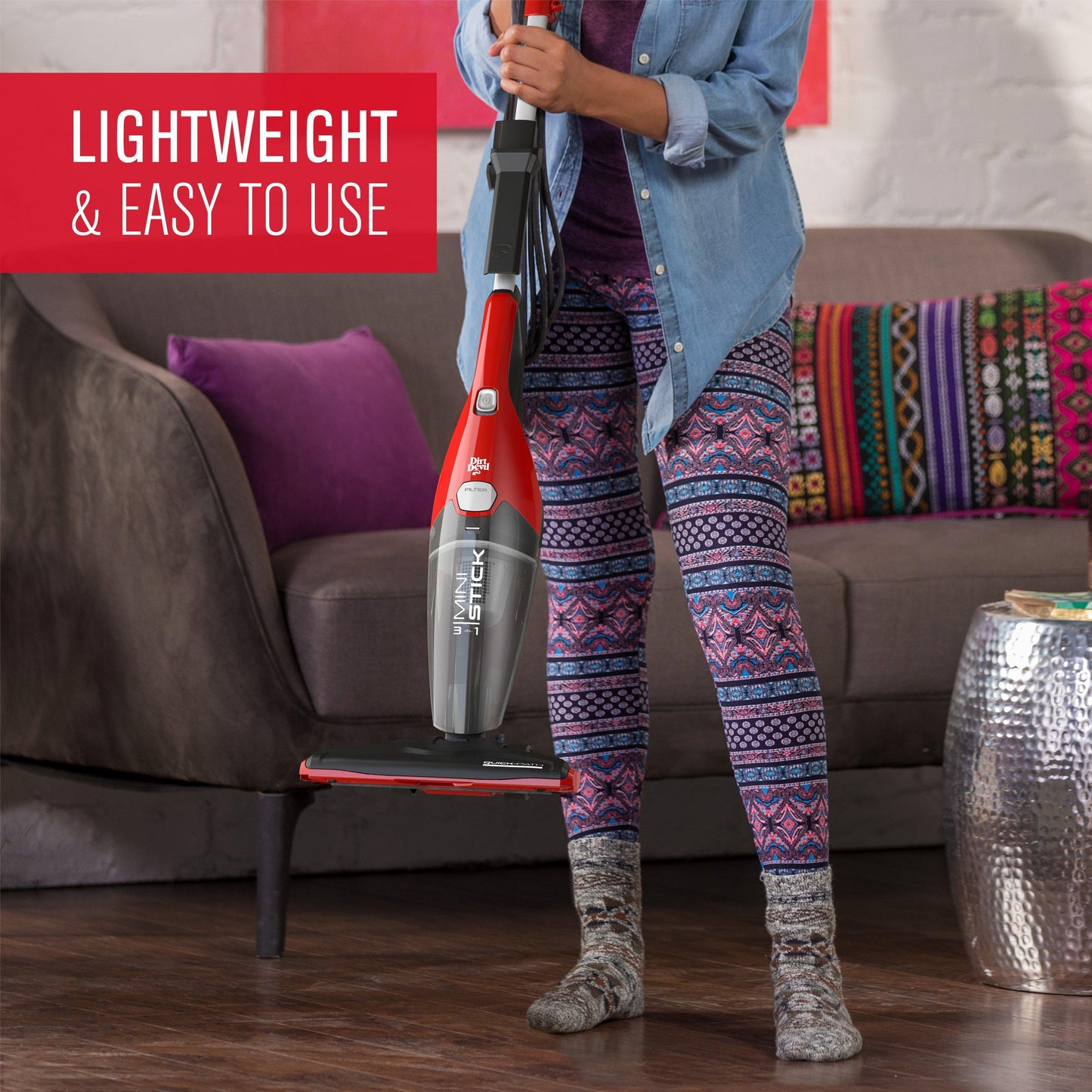 A woman easily lifts the lightweight 3-in-1 dirt devil stick vacuum